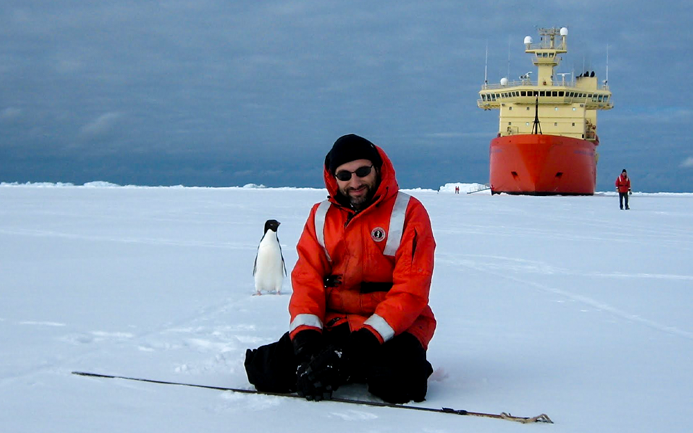 Tozzi posing with a penguin during an "ice call" off of the Nathaniel B. Palmer icebreaking research vessel (RVIB) in the Ross Sea in February 2007. Photo provided by Sasha Tozzi.