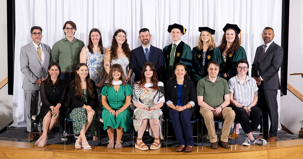 W&M School of Marine Science graduates pose for a picture at their Diploma Ceremony. VIMS photo