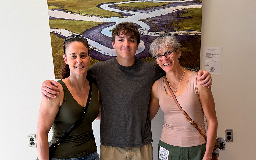 Connor Castle (center) with his aunt, Suzanne Paul (left), and his mother, Kathleen Castle (right). Photo by Ethan Smith.