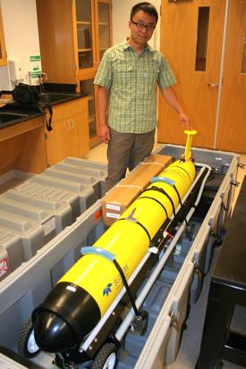 Asst. Professor Donglai Gong with his glider in the lab.