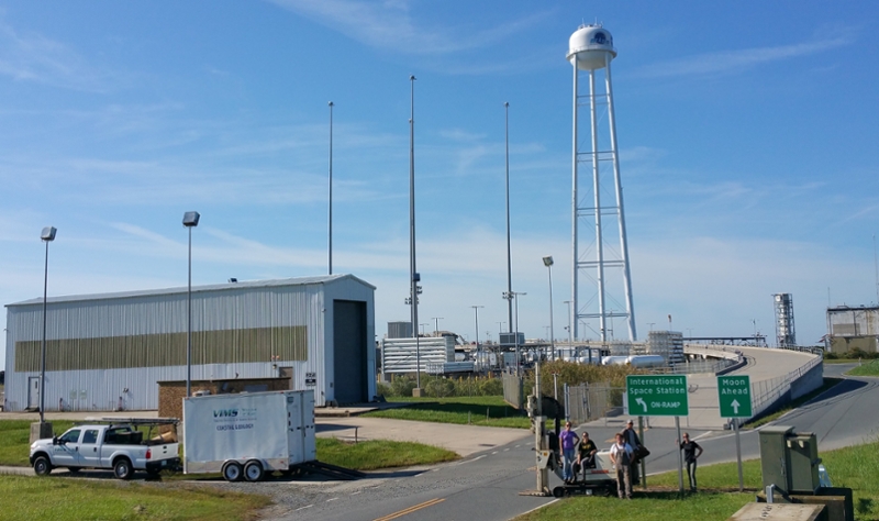 Coastal Geology Lab field team poses in wide-angle shot on NASA Wallops Flight Facility campus