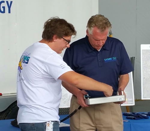 Coastal Geology Lab graduate student Justin Shawler shows Virginia governor, Terry McAuliffe, how to use ground-penetrating radar collection equipment