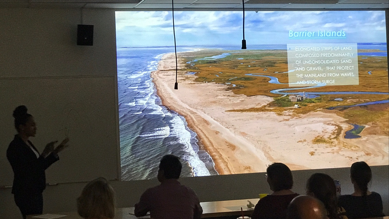 Student presents senior research presentation in classroom