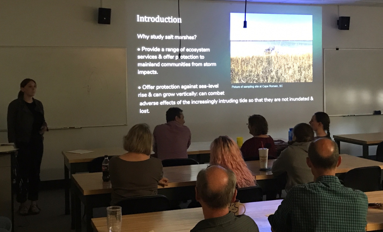 Student presents senior research presentation in classroom